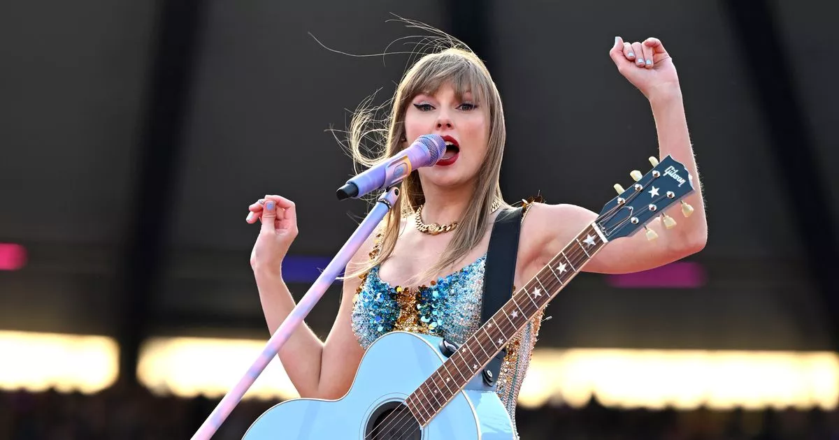 Taylor Swift's Wardrobe Adjustment: Battling the Elements on Stage